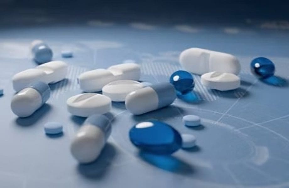 Various blue and white pills scattered.