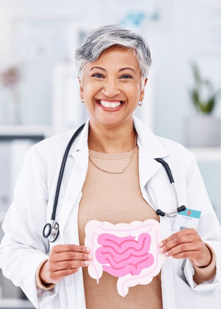 Doctor holding anatomical model of intestines.